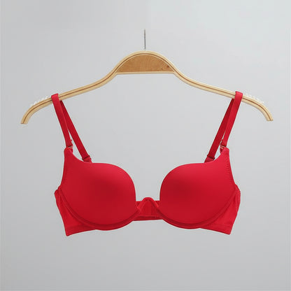 Red bra on a hanger with a white background