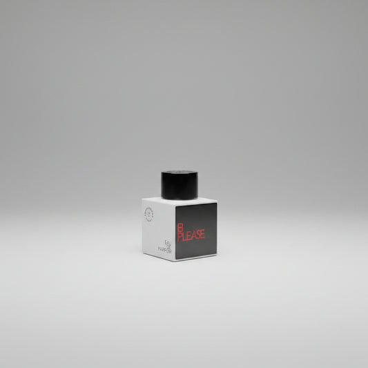 Perfume bottle labeled 'B Please' by 'Confessions of a Rebel' on a white background