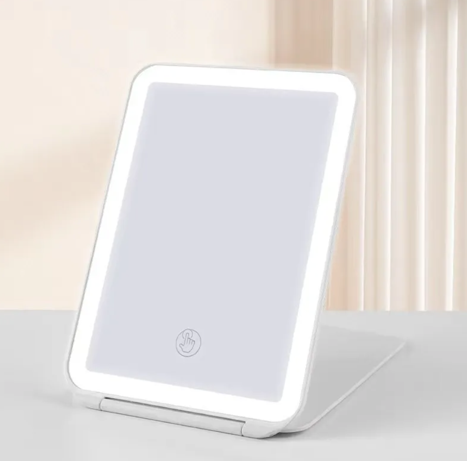 VividAura LED Desk Mirror from Zenvia Beauty's FoldBright Series, featuring a sleek, illuminated mirror with adjustable brightness settings.