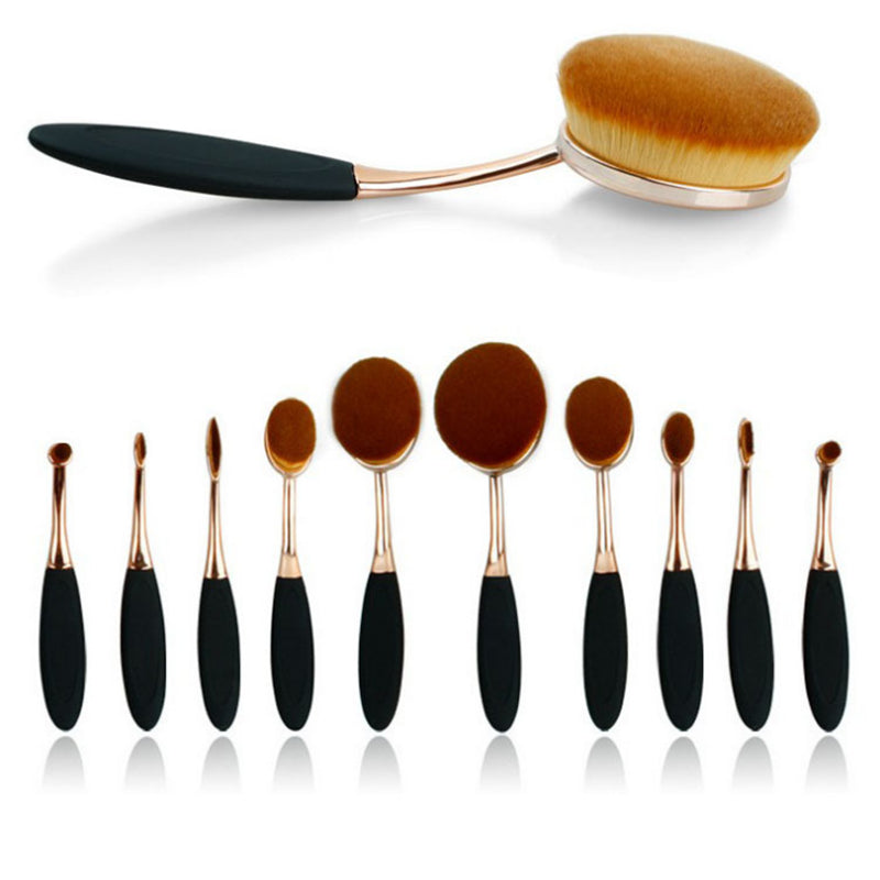 Set of three oval makeup brushes from Zenvia Beauty with soft bristles and sleek handles, perfect for blending and applying cosmetics.