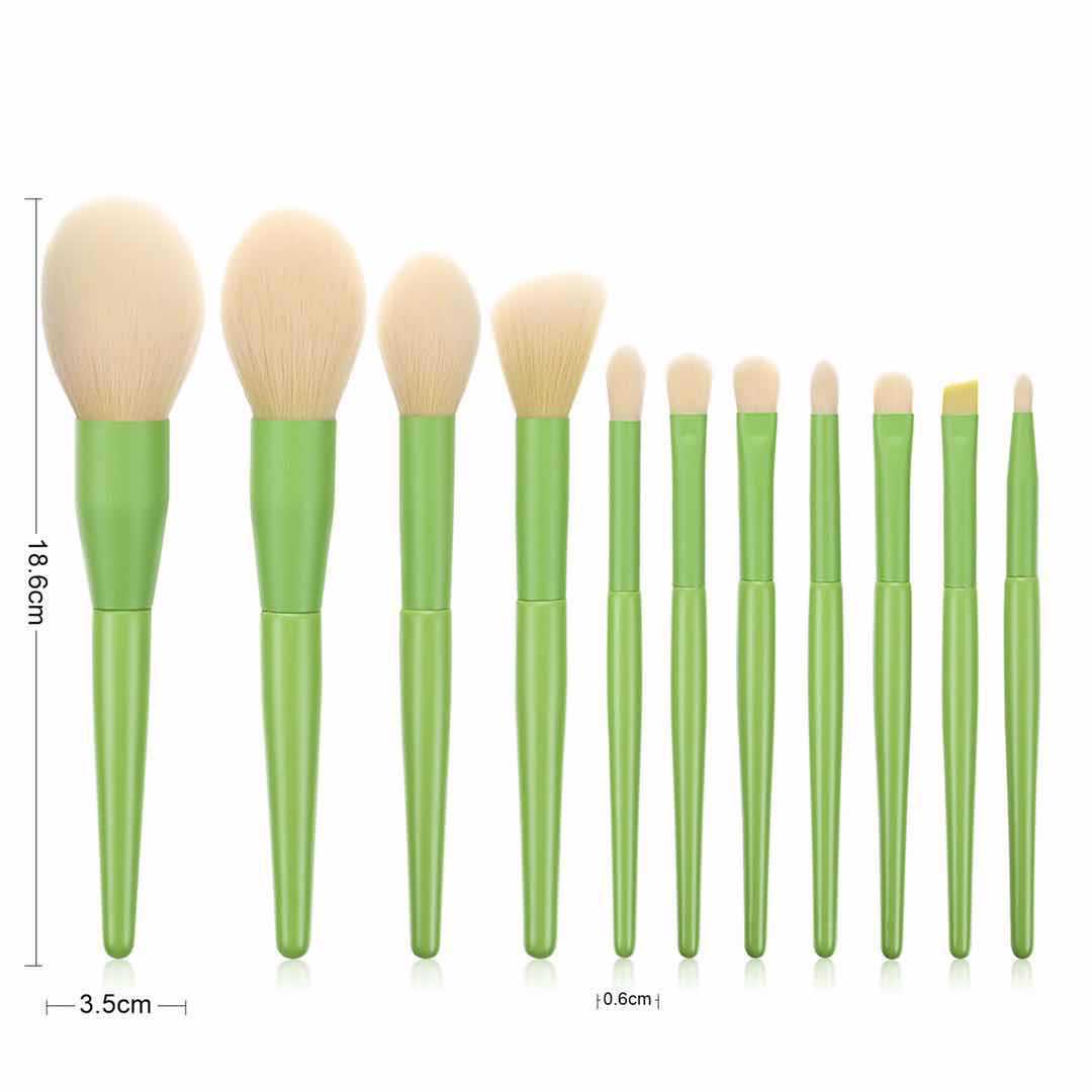 Set of three yellow Zenvia Beauty makeup brushes with soft bristles and sleek handles for professional makeup application.