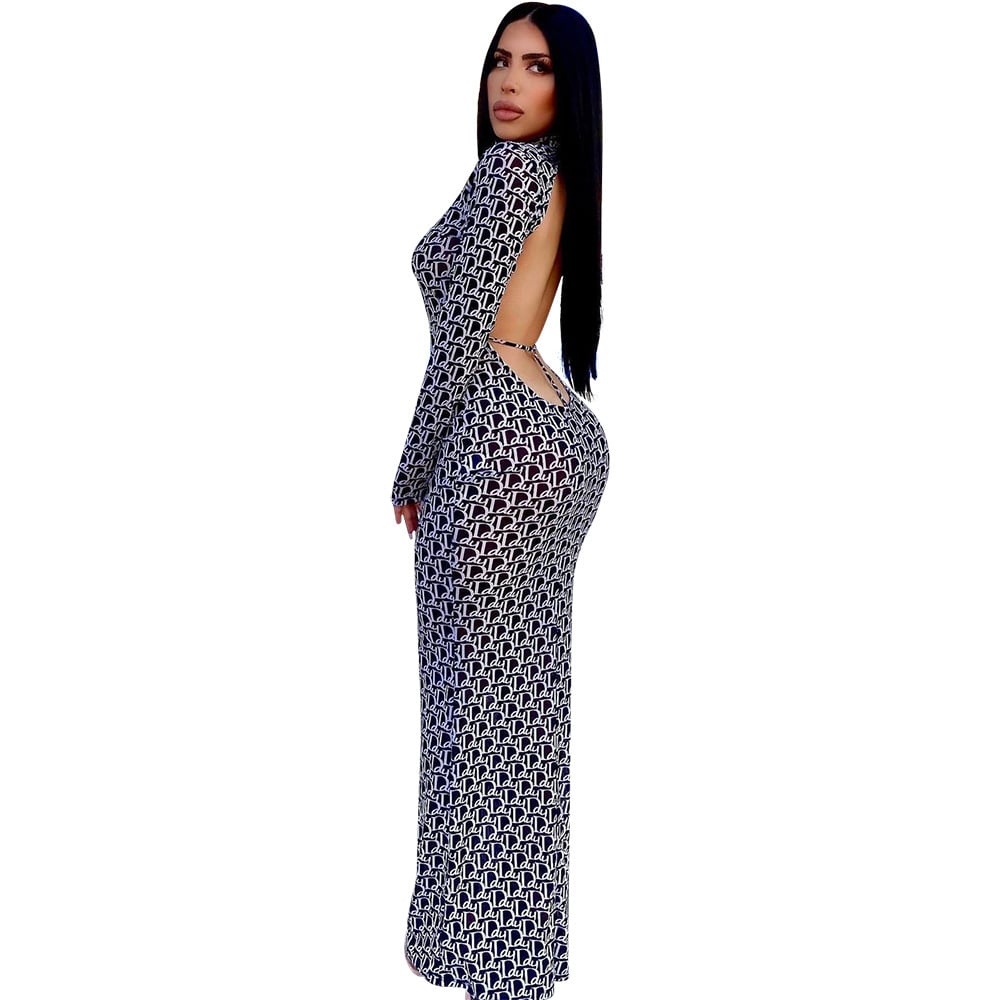 Women's backless printed dress by Zenvia Beauty featuring vibrant floral pattern and flowing fabric, perfect for summer occasions.