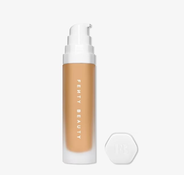 Fenty SoftLit Luminous Foundation by Zenvia Beauty in a sleek bottle, showcasing its smooth, luminous finish for radiant skin.