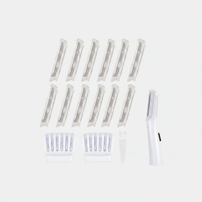 Set of white hair clippers with multiple attachments on a white background