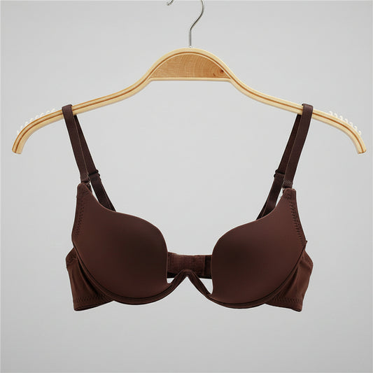 Brown bra on a hanger with a white background