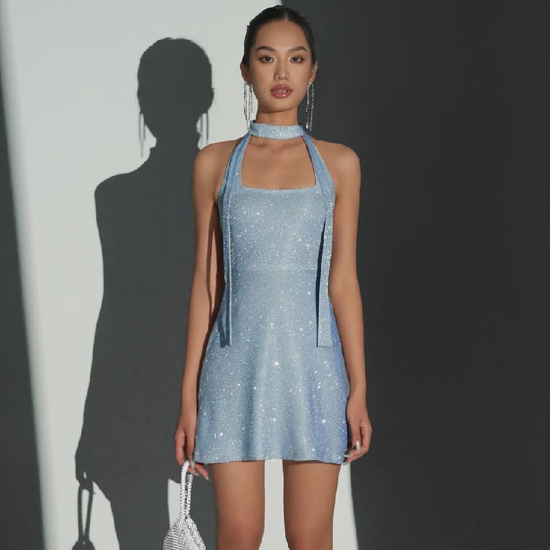 Women's shiny backless ribbon dress by Zenvia Beauty, featuring a sleek design with a bow back and elegant fit.