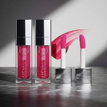 Lip glow oil with pink applicator on a white background