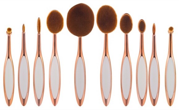 Zenvia Beauty 10-piece oval brush set with various sizes, featuring soft bristles and sleek handles for makeup application.