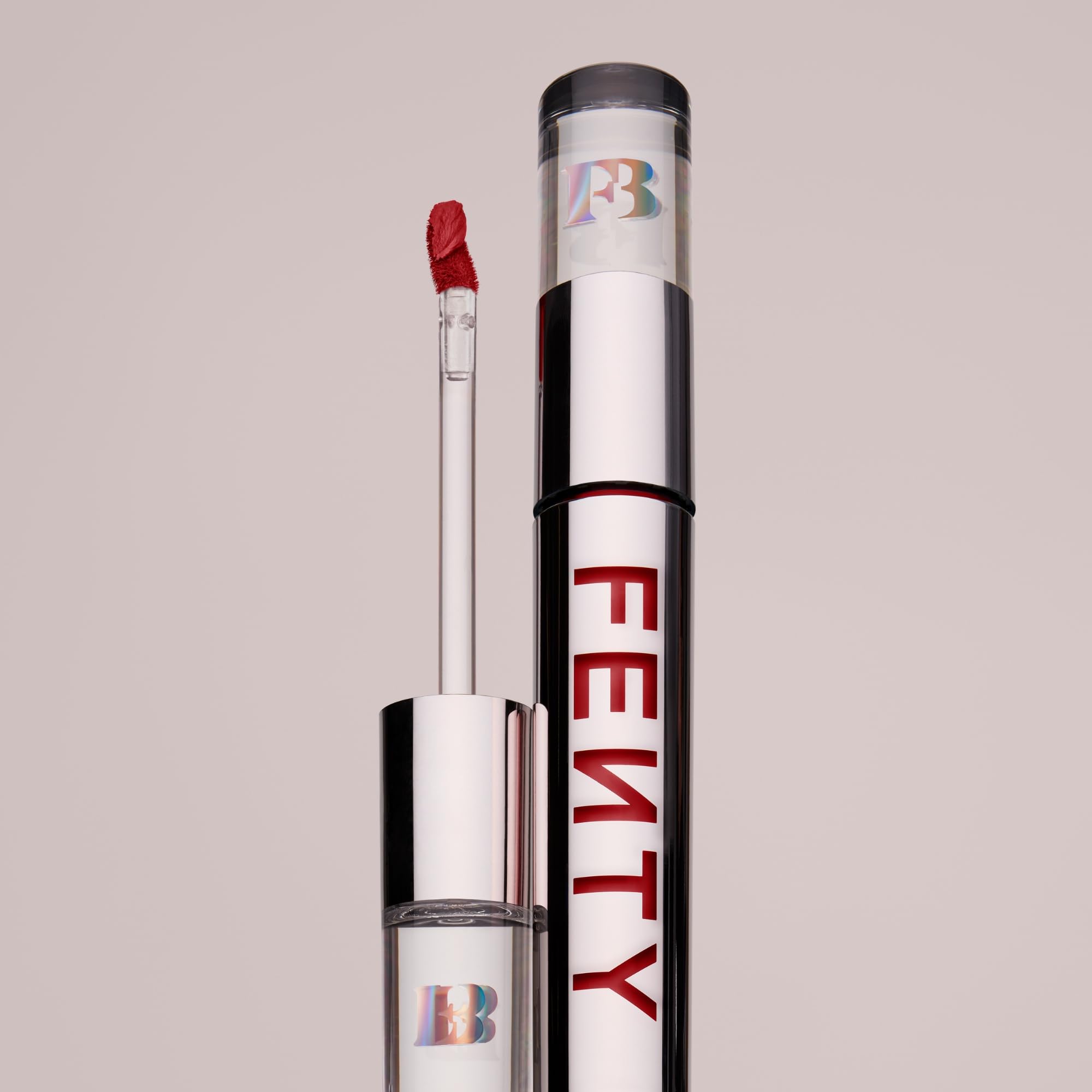 Fenty Icon Velvet Lipstick by Zenvia Beauty featuring a sleek tube and a vibrant, velvety red lipstick bullet.