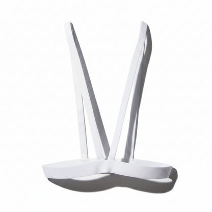 White plastic tray with two ladles on a white background