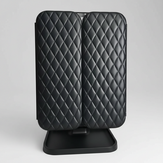Pair of black quilted car seat covers on a stand against a white background